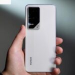 Honor GT Pro in Cyber Silver color with gaming accessories